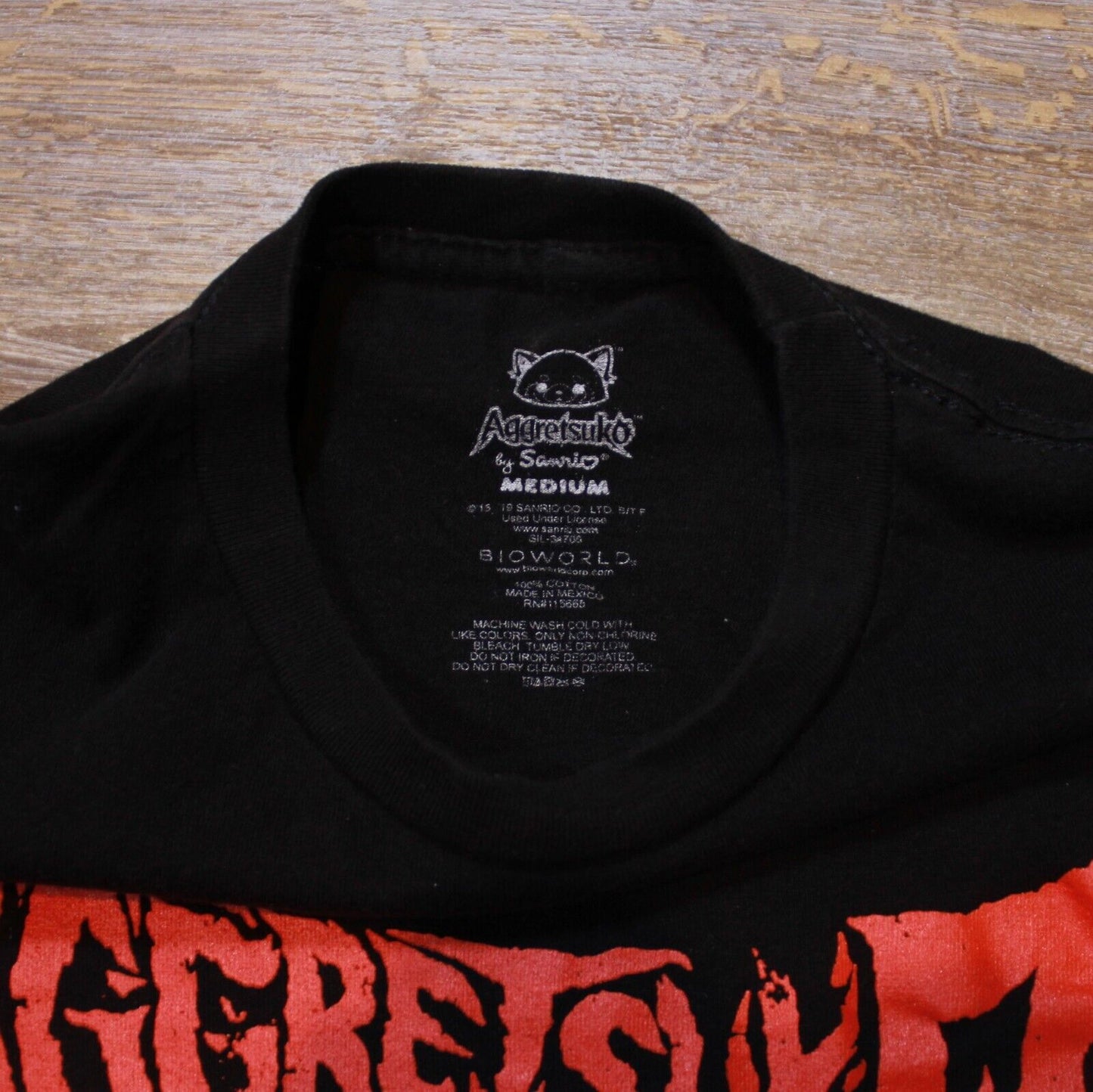 Aggretsuko Standing Calm in a Mad Demon's Shadow Bio World Mens - Medium